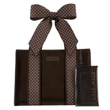 A brown tote bag with white polka-dot handles and a matching clear phone case with a large bow, both branded CASE-MATE, shown on a plain white background.
#color_espresso polka dot bow