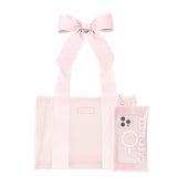A light pink transparent tote bag with a matching fabric ribbon bow on the handle, shown alongside a matching translucent phone case on a plain white background.
#color_ballet pink bow