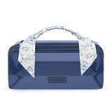 A glossy navy blue cosmetic case with a top zipper, featuring a matching floral necktie handle and a small black CASEMATE logo plaque on the front.
#color_something navy twilly