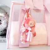 Pink plush keychain with decorative elements on a pink background
#color_ballet pink bow