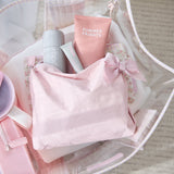 Pink skincare products including a bottle and tube with 'Summer Fridays' branding, placed on a white surface.
#color_ballet pink bow