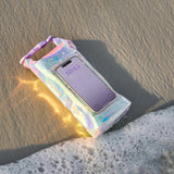 Iridescent phone case with a phone inside on sand
#color_iridescent