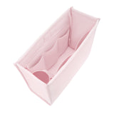 A light pink fabric organizer insert with multiple internal compartments, shown from an elevated angle on a solid white background.
#color_ballet pink bow
