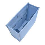 A light blue structured bag filler organizer with multiple interior compartments, shown empty on a solid white background.
#color_carolina blue