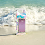 Phone case with a colorful, iridescent design on a beach
#color_iridescent