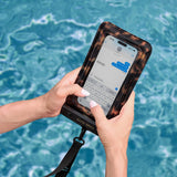 Person holding a phone with a water-resistant case over a pool #color_tortoiseshell