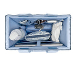 Top-down view of a light blue organizer bag filled with travel accessories, including a laptop sleeve, wallet, pouch, and a white tumbler, on a white background.
#color_carolina blue