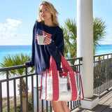 Woman holding a mug with a scenic ocean view in the background
#color_cherry gingham