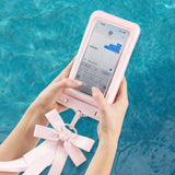 Person using a pink phone case with a stand feature by a pool.
#color_ballet pink bow