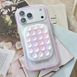 Phone case with bubble design on a decorative surface
#color_iridescent