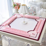 A pink and white table game board set on a white table, featuring translucent pink plastic pieces and a central white lamp styled in a bright, modern living room setting.
#color_classic ballet pink