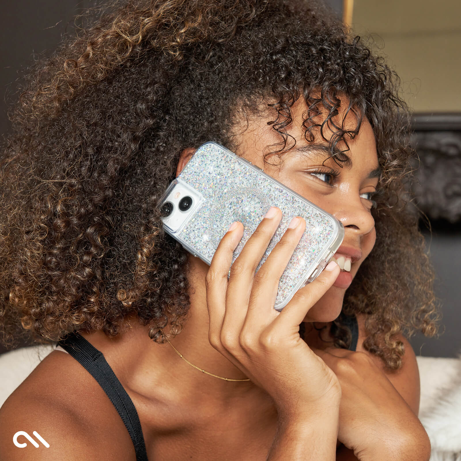 WOMAN TALKING ON PHONE WITH TWINKLE DISCO CASE
