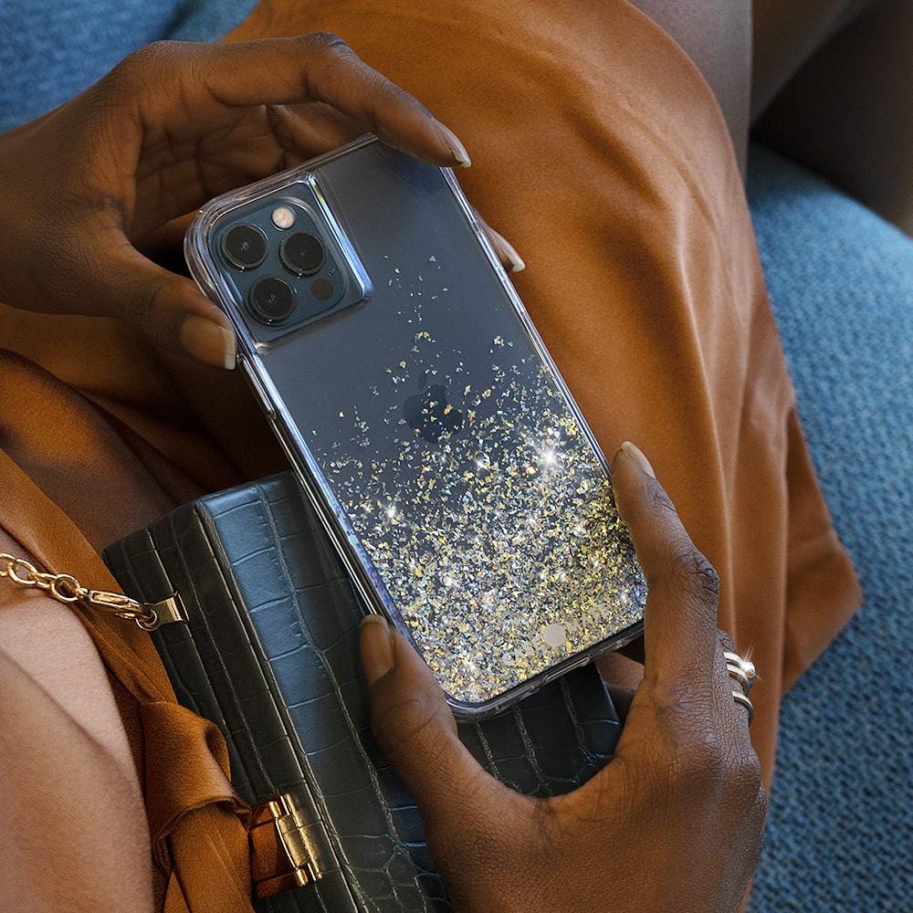 Hands holding Twinkle Ombre case on lap. color::Twinkle Confetti
