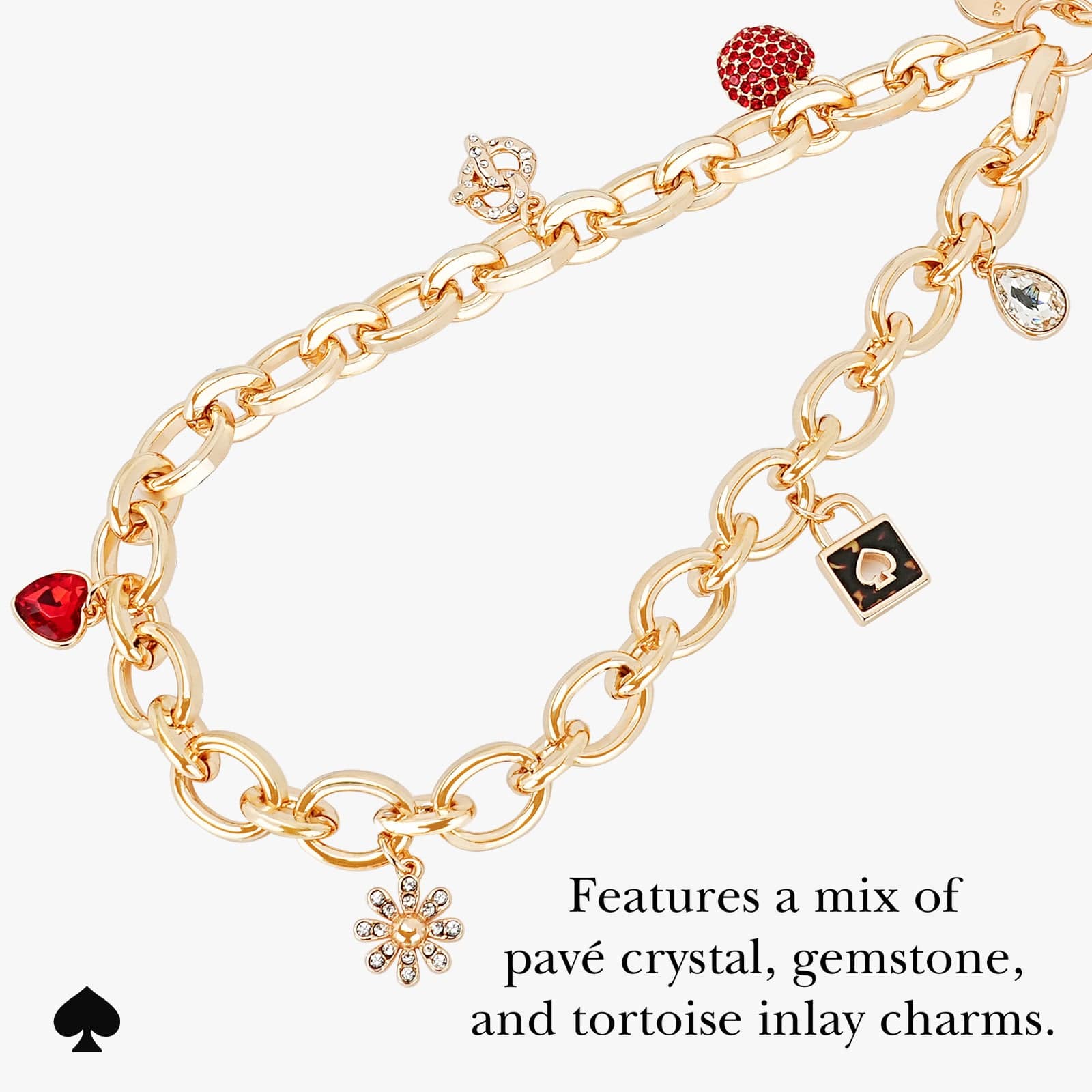 FEATURES A MIS OF PAVE CRYSTAL, GEMSTONE, AND TORTOISE INLAY CHARMS.