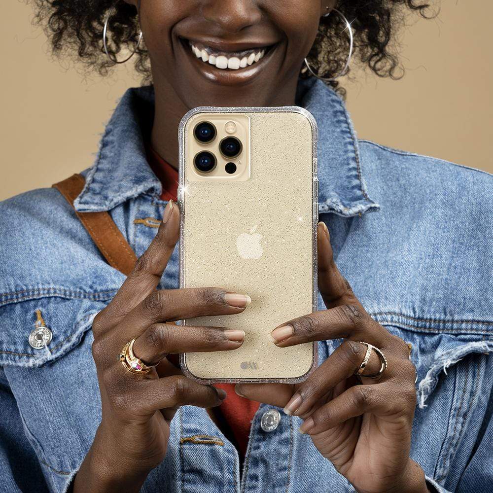 Woman holding Sheer Crystal Clear case. color::Clear