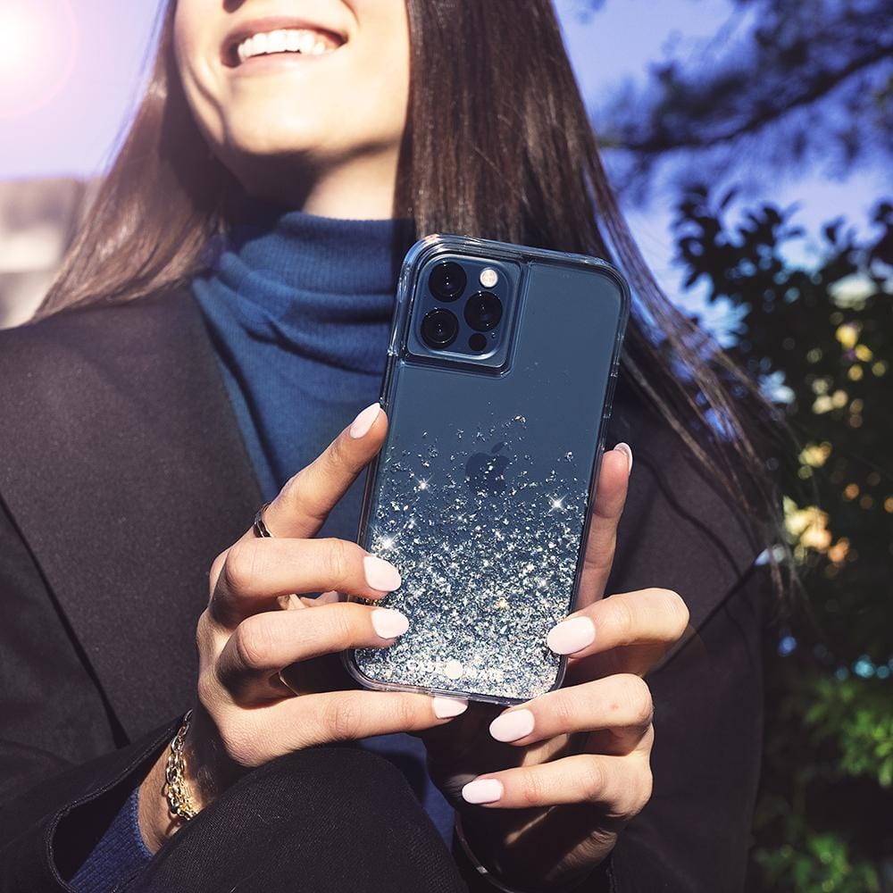 Woman holding case. color::Twinkle Stardust