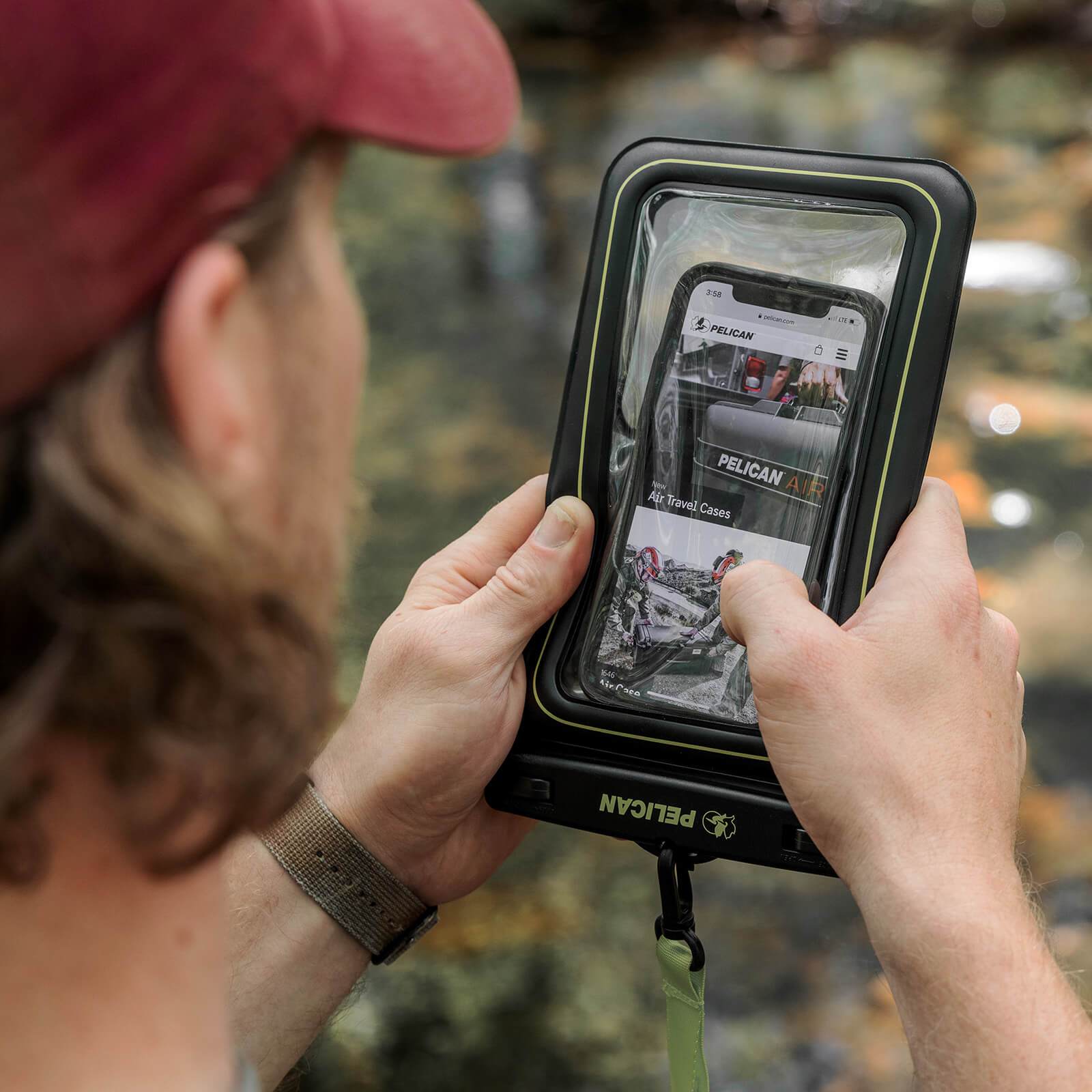 Phone being used through pouch. color::Black/Hi Vis Yellow