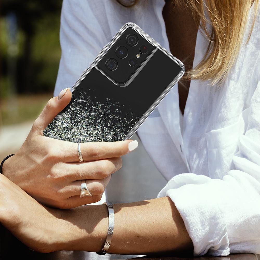 Hand holding Twinkle Ombre case. color::Twinkle Stardust