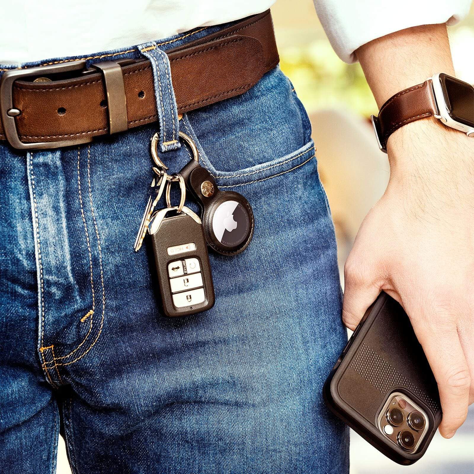 AirTag Keychain Case attached to keys through belt loop.  color::Black