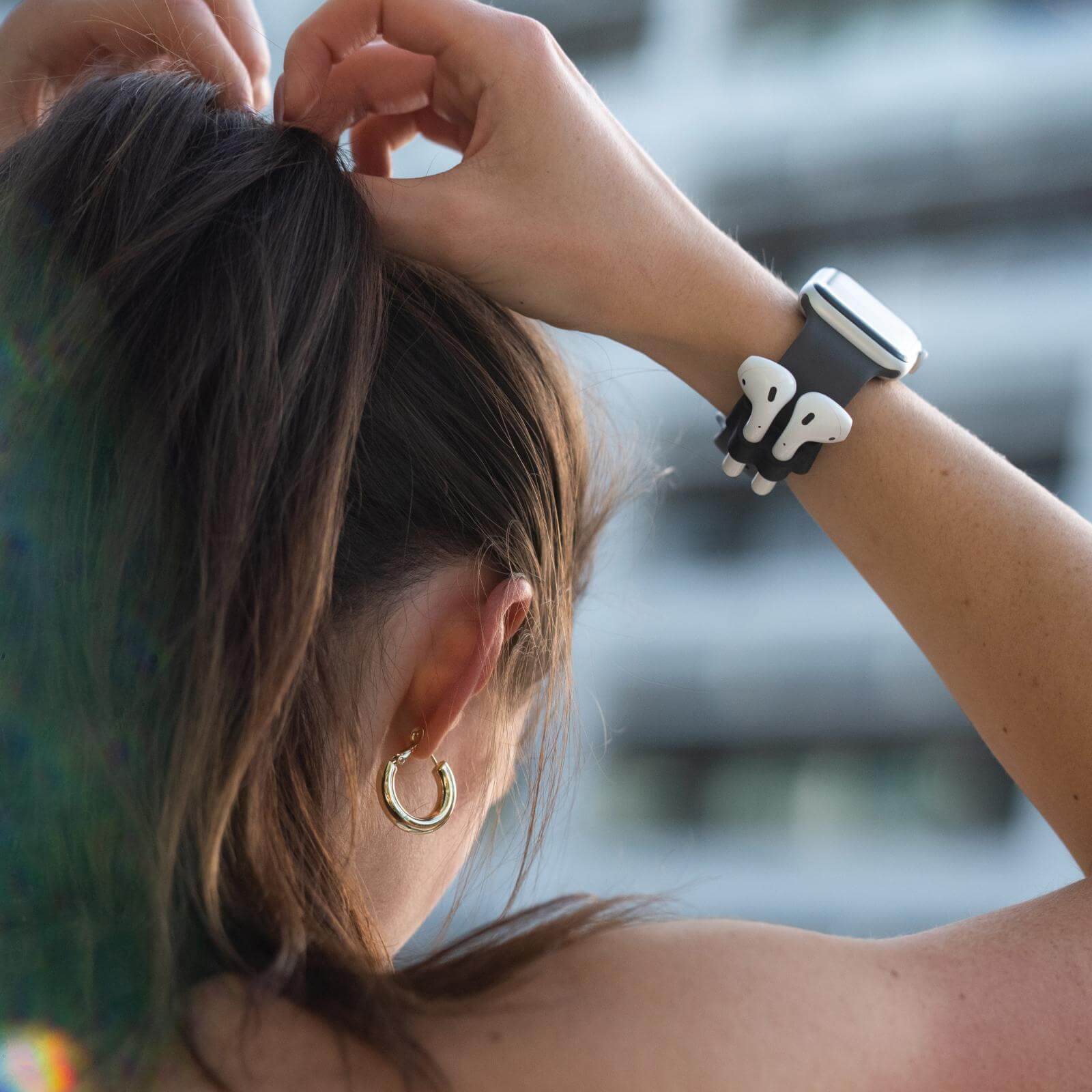 AirPods in AirPod Watch Band Holder. color::Black