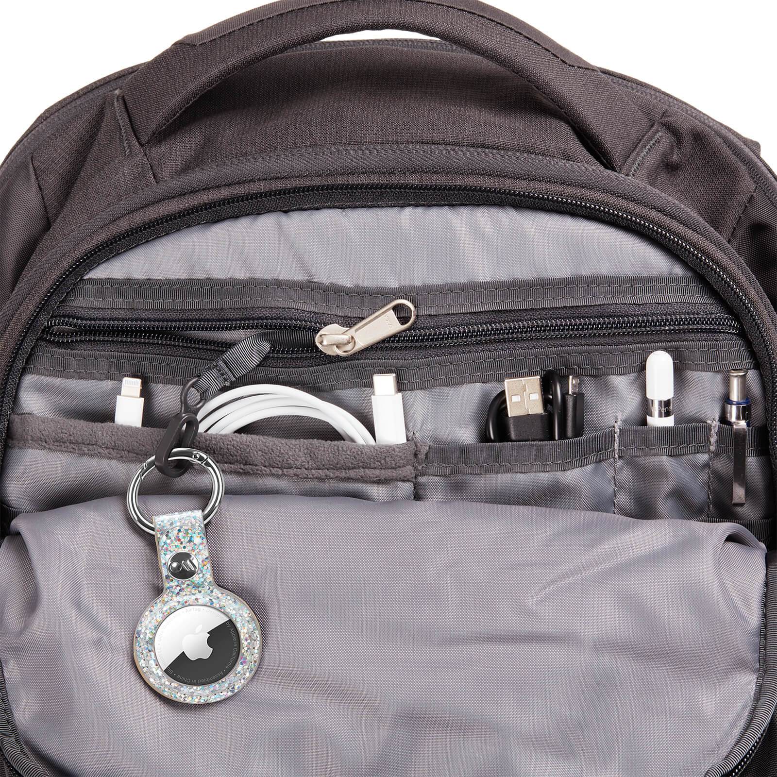 AirTag Keychain Case attached to inside of backpack. color::Sparkle