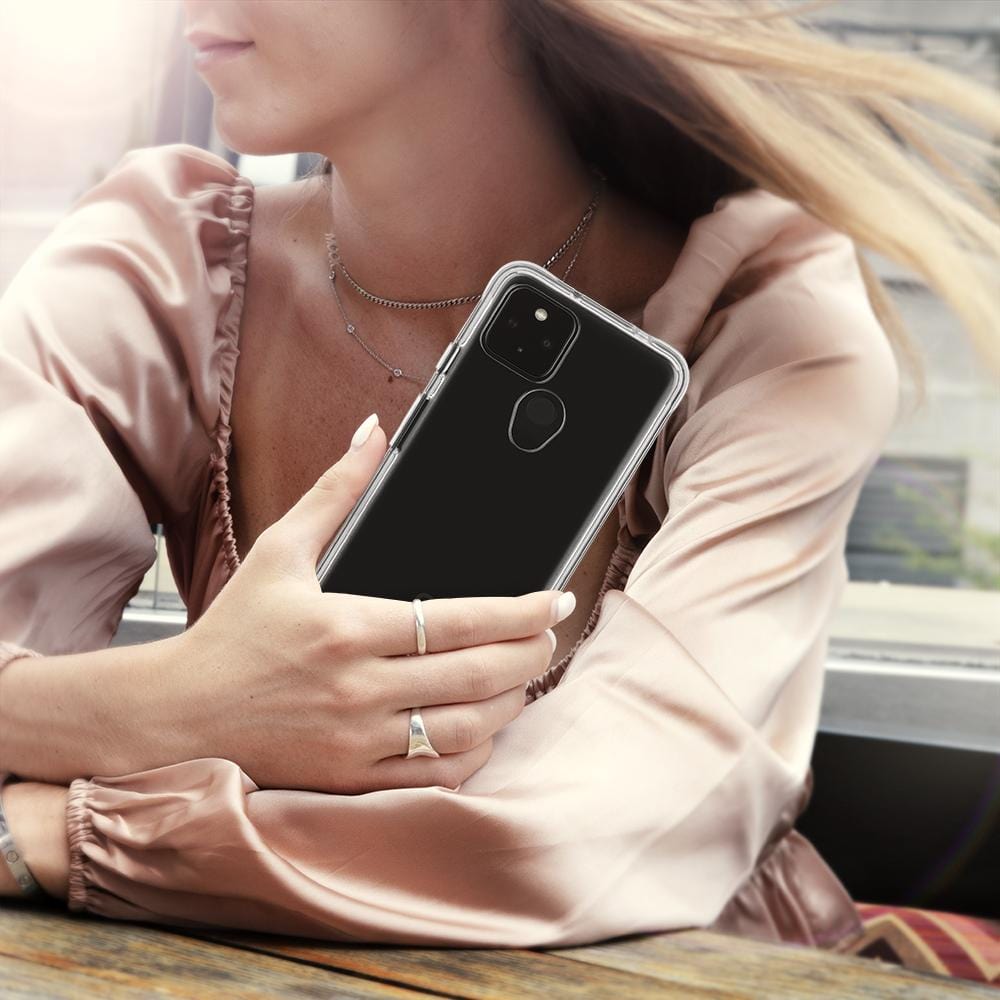 Woman holding ECO 94 Clear phone case. color::Clear