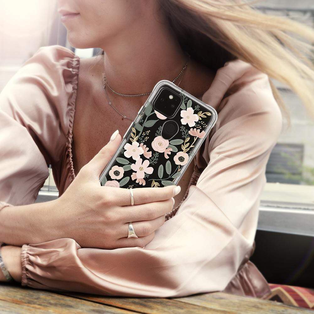 Woman holding pink floral RPC case. color::Wild Flowers