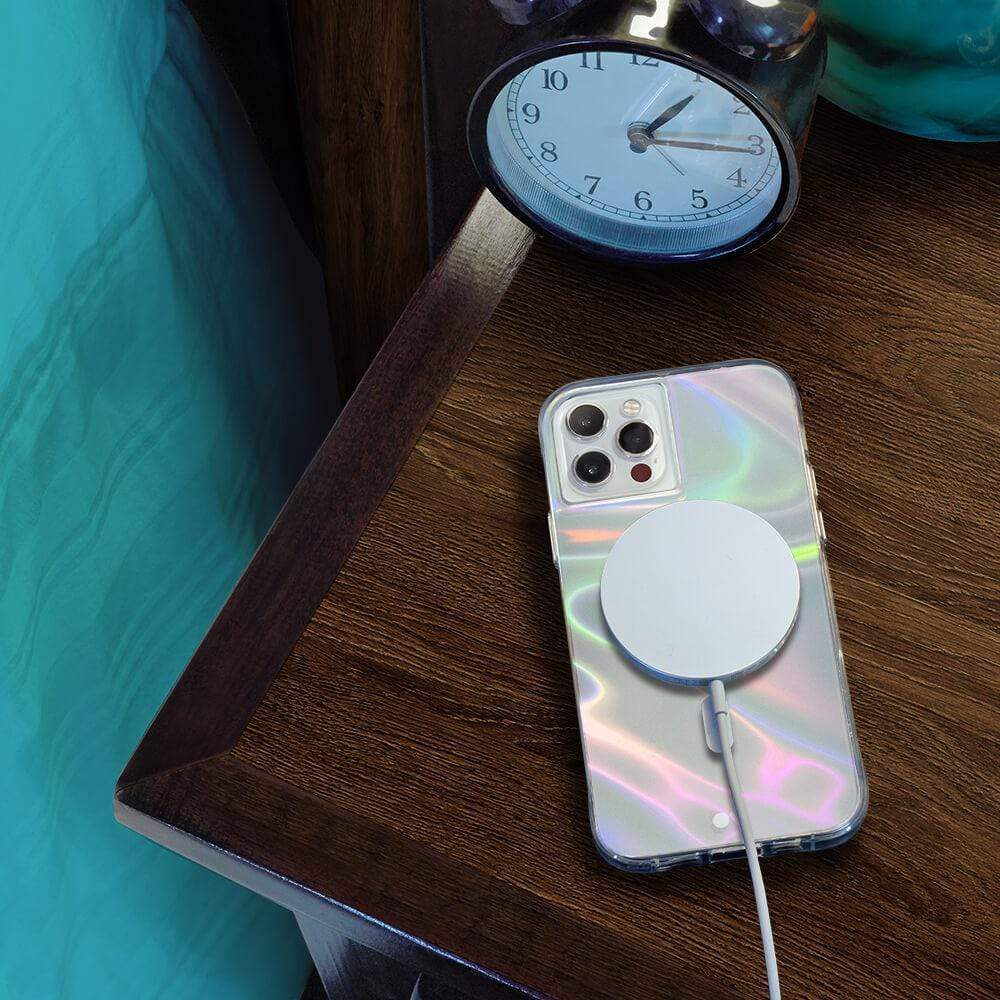 Soap Bubble connected to a MagSafe charger on a bedside table. color::Soap Bubble