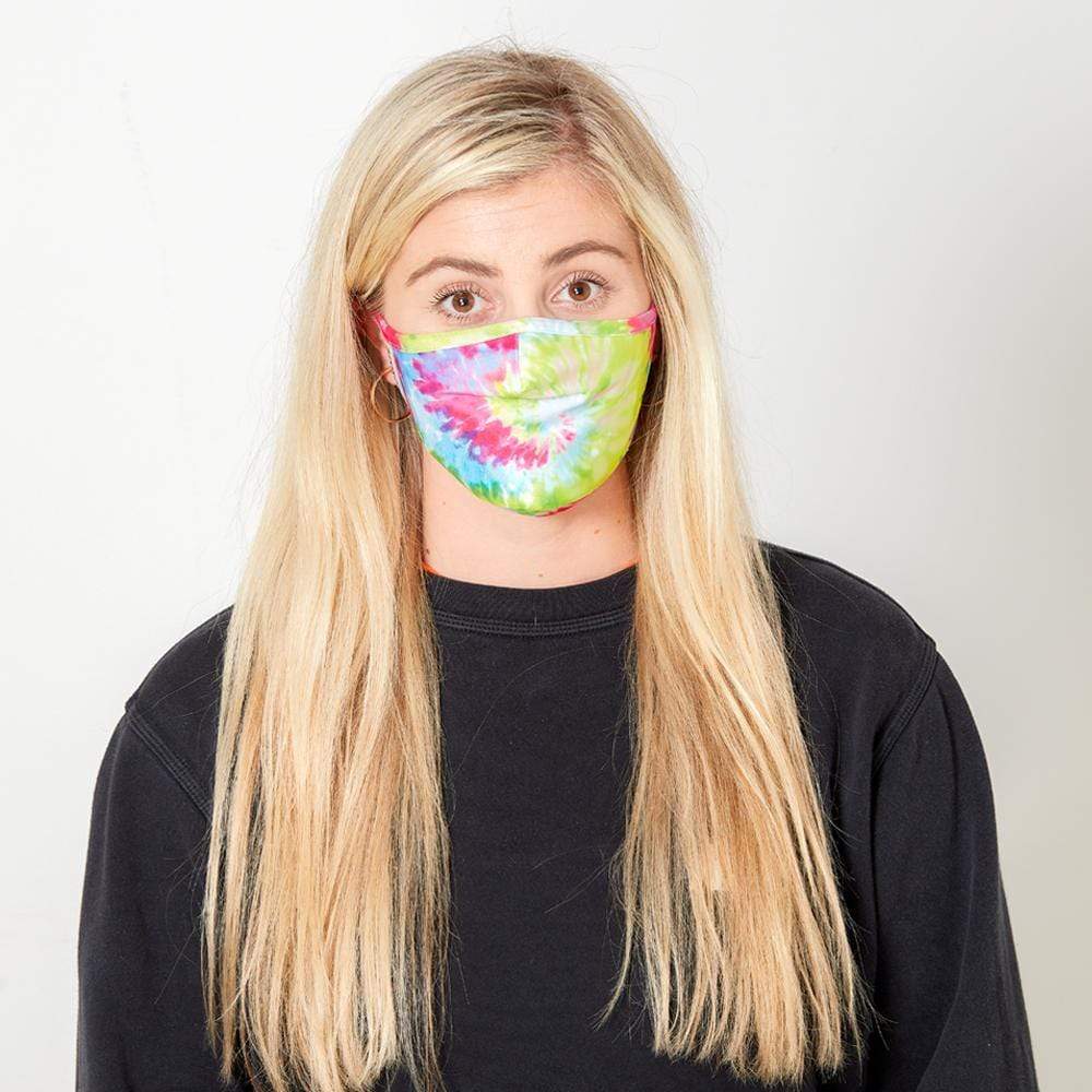 Woman wearing bright colored Tie-Dye cloth face mask. color::Tie-Dye
