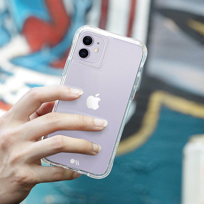 a person holding an iphone with a clear case
