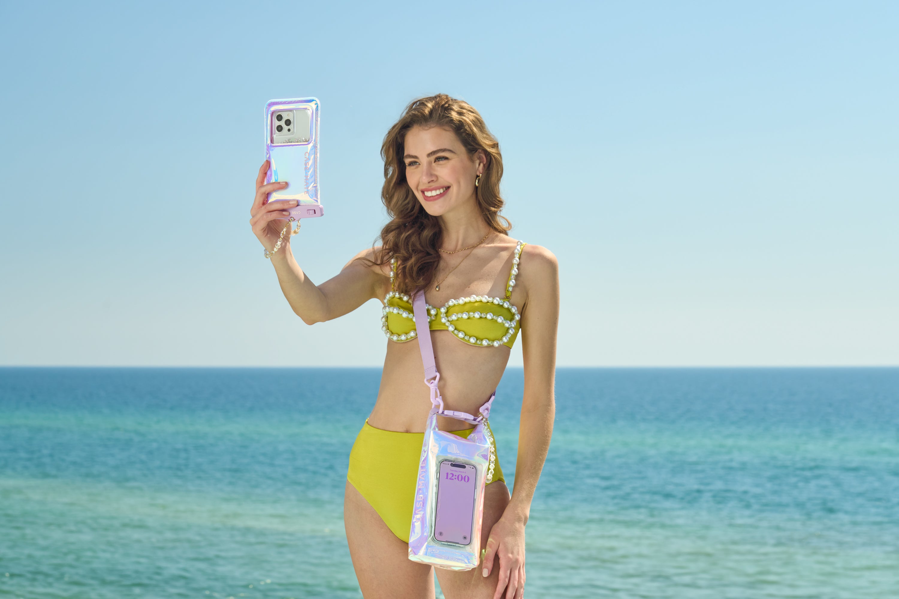 Woman Taking Pictures On The Beach