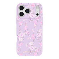 Lavender iPhone case with pink and white floral pattern, triple rear camera cutouts, and MagSafe compatibility.