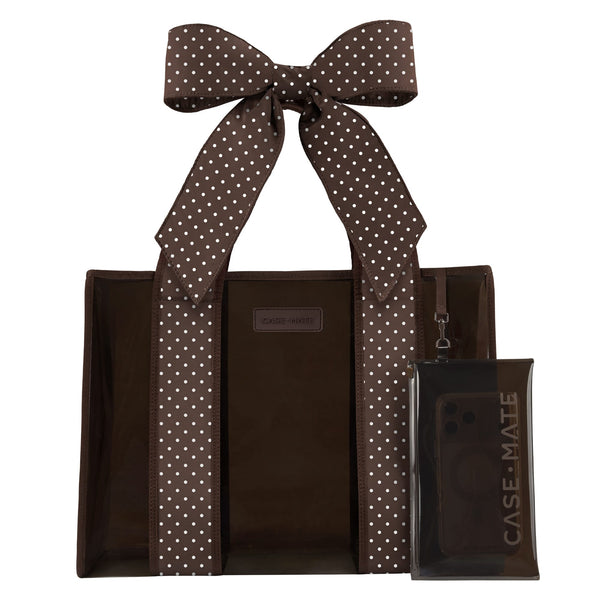A brown tote bag with white polka-dot handles and a matching clear phone case with a large bow, both branded CASE-MATE, shown on a plain white background.
#color_espresso polka dot bow