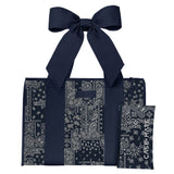 A navy blue and white paisley bandana tote bag with matching shoulder straps and a matching pouch, shown on a plain white background.
#color_navy bandana bow