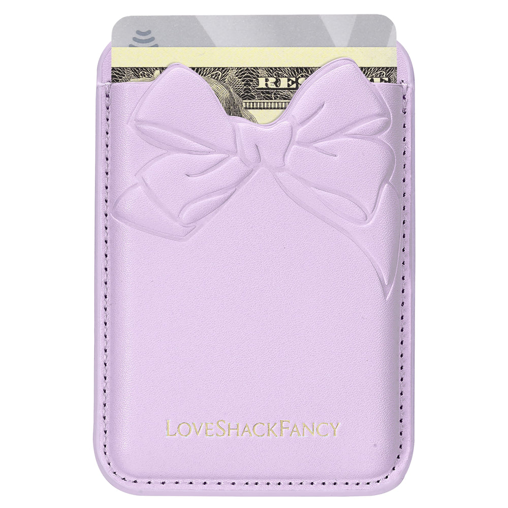 Purple cardholder with bow design featuring 'LOVE SHACK FANCY' branding on a white background
#color_purple