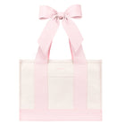 A light pink and white tote bag with wide pink shoulder straps and a large matching pink bow at the top, shown on a plain white background.
#color_ballet pink bow