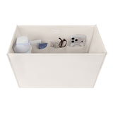 A white fabric organizer box with multiple interior pockets holding small items like a blue-and-white bottle, glasses, and a smartphone case, shown on a plain white background.

#color_french vanilla 