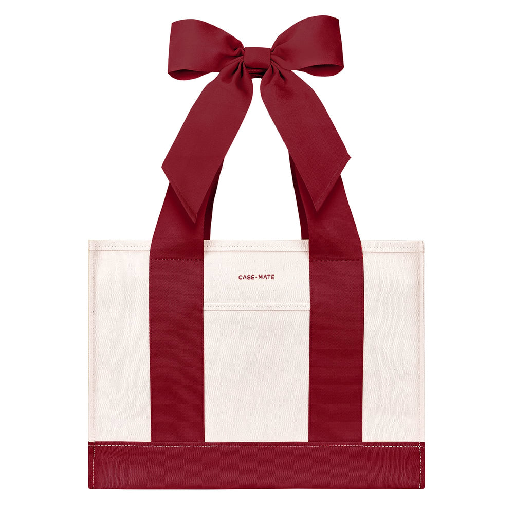 A red and white tote bag with wide pink shoulder straps and a large matching pink bow at the top, shown on a plain white background

#color_cranberry bow