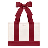 A red and white tote bag with wide pink shoulder straps and a large matching pink bow at the top, shown on a plain white background

#color_cranberry bow