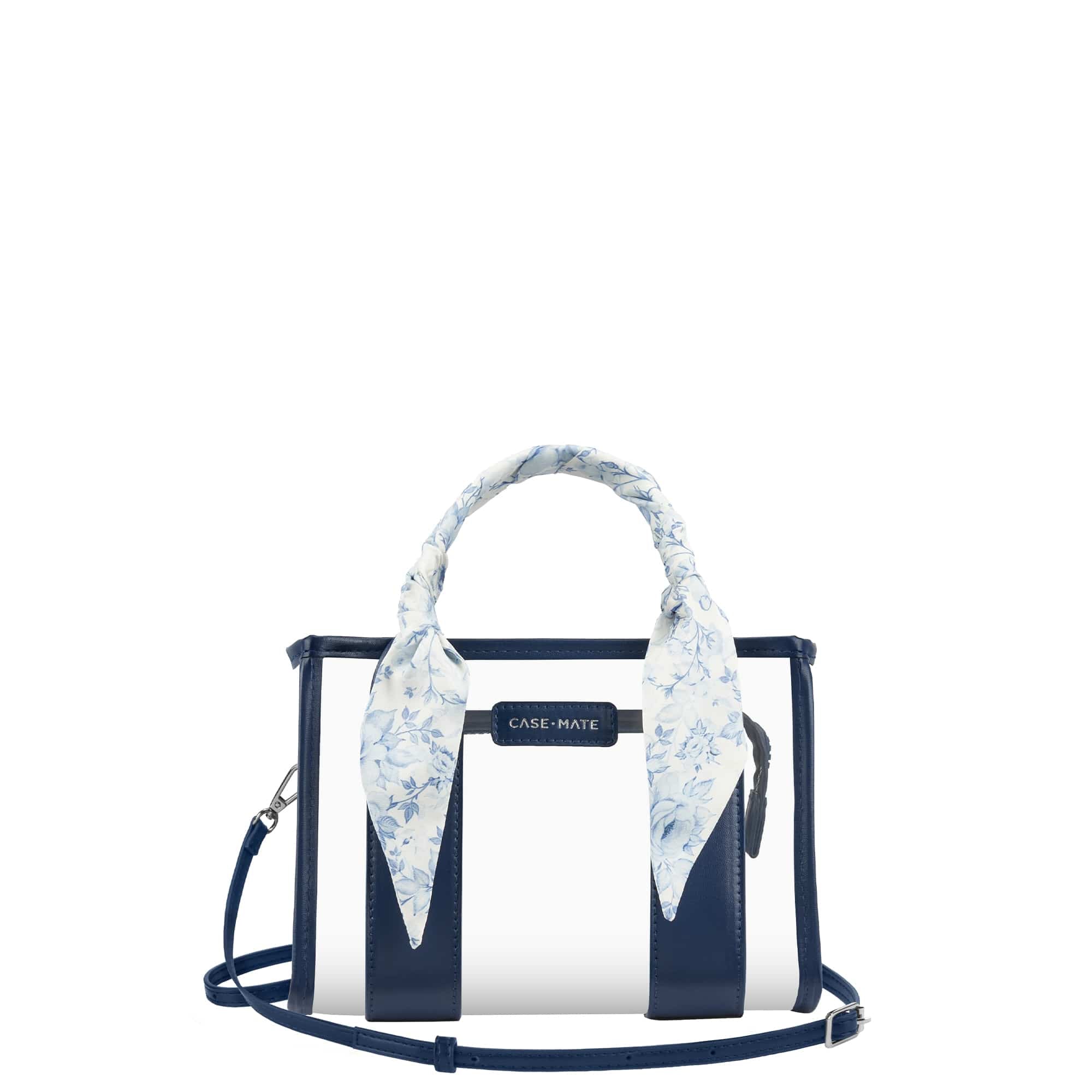 A Case-Mate structured handbag with navy blue and white vertical stripes, featuring a light blue and white floral silk scarf tied to the top handle, set against a plain white background.

#color_something navy twilly