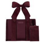 Red velvet straps on a burgundy Jelly Tote Bag on a while background 
#color_holiday edition red velvet bow