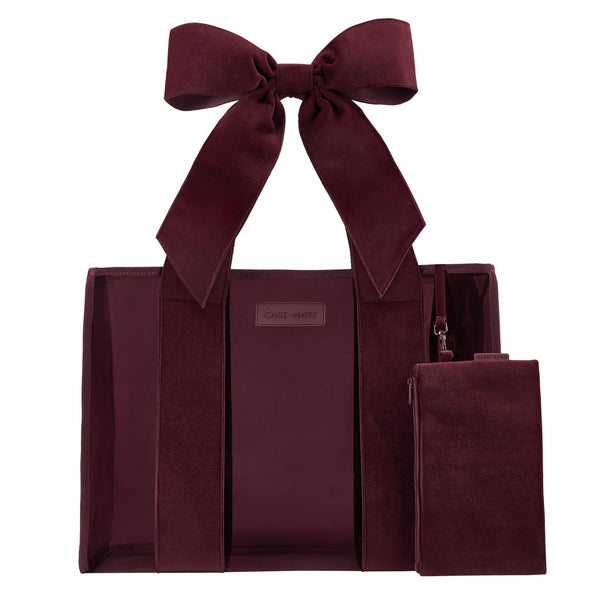 Red velvet straps on a burgundy Jelly Tote Bag on a while background 
#color_holiday edition red velvet bow