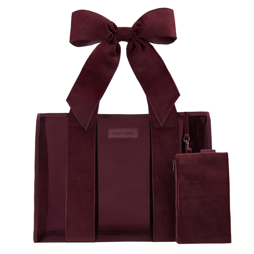 Red velvet straps on a burgundy Jelly Tote Bag on a while background 
#color_holiday edition red velvet bow