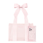 A light pink transparent tote bag with a matching fabric ribbon bow on the handle, shown alongside a matching translucent phone case on a plain white background.

#color_ballet pink bow