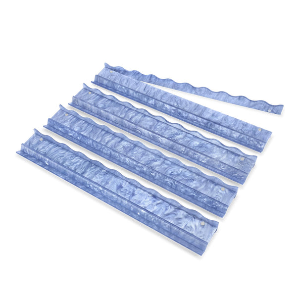 Five blue translucent corrugated plastic or acrylic trim pieces arranged diagonally on a plain white background.
#color_carolina blue pearl