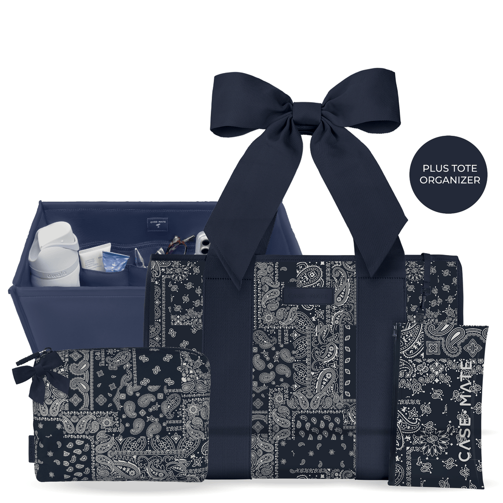 A navy blue and white bandana-patterned tote organizer set with matching accessories, including a large bow, a zip pouch, a small pouch, and an organizer tray, shown on a white background with a black circular label that reads 'PLUS TOTE ORGANIZER'.