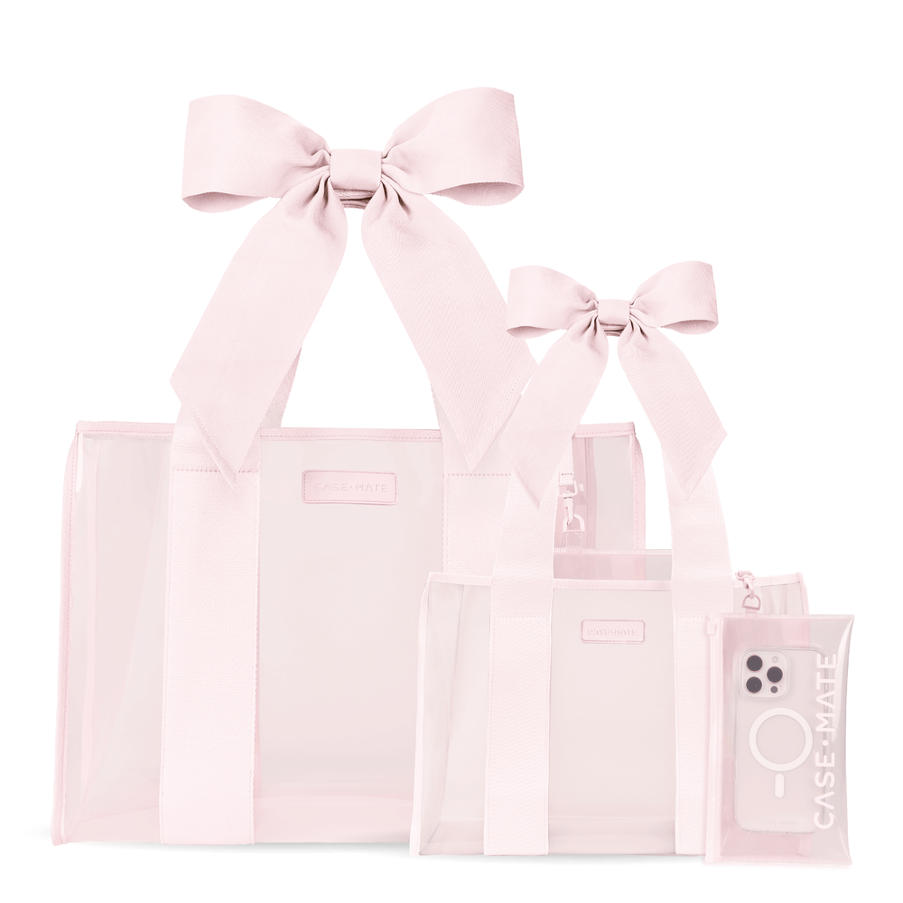 Three light pink transparent tote bags of different sizes with matching ribbon handles and a small matching zip pouch, photographed on a clean white background.