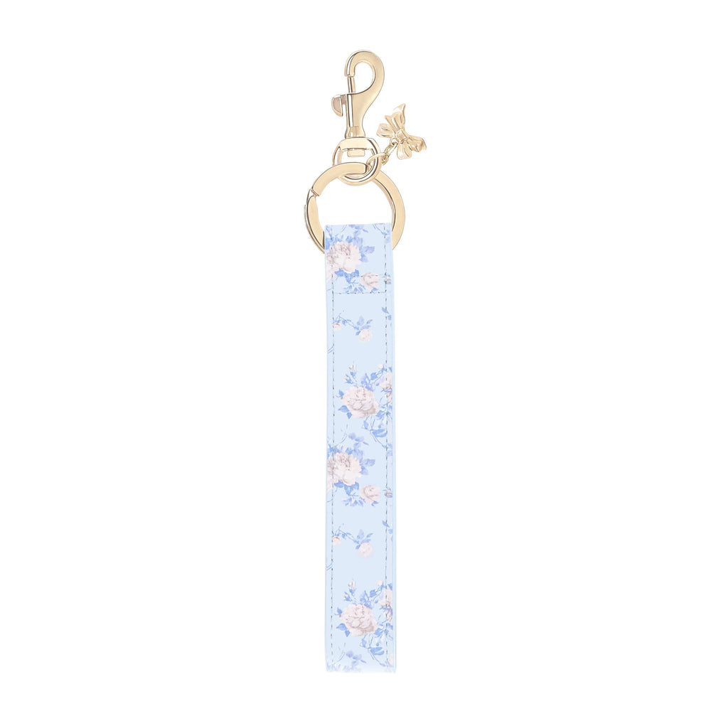 Keychain with floral patterned strap on a white background 
#color_everblooming rosettes