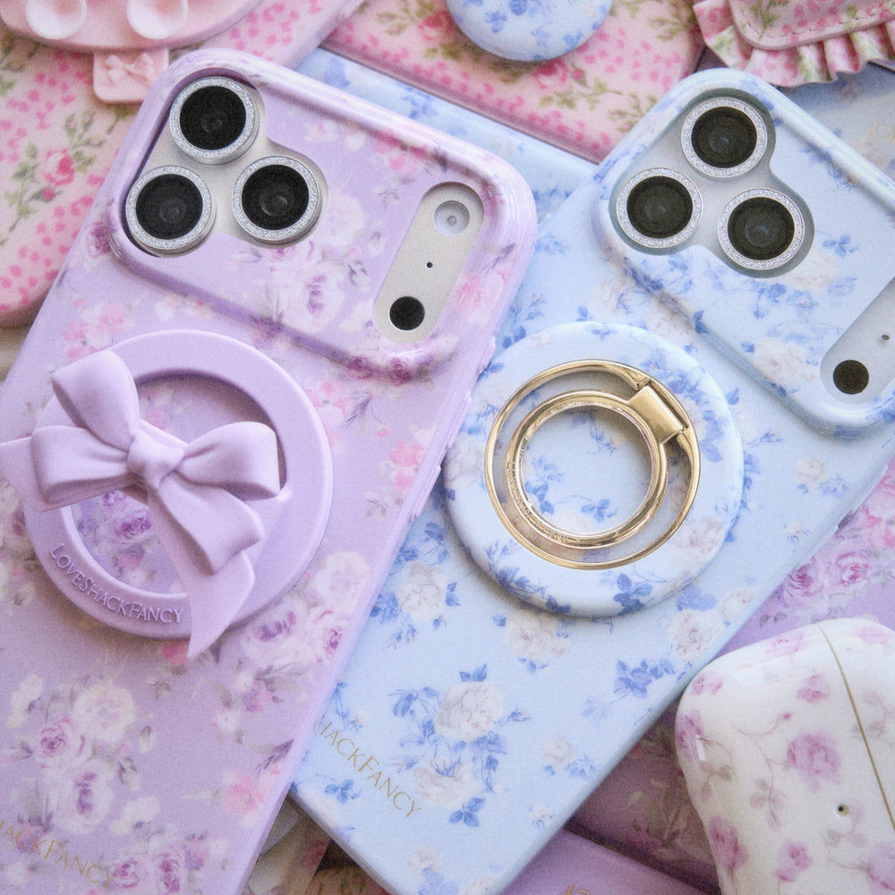 Phone cases with floral designs and accessories on a floral background
#color_purple