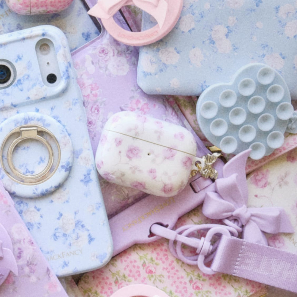 Collection of pastel-colored phone cases and accessories on a floral 
background
#color_ribbon rosa flora